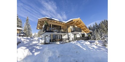 Hüttendorf - Bar/Pub - Tux - Herzlich Willkommen auf der Sam-Alm Snow&Bike in Hochkrimml 
Winter Aussen - Sam-Alm 