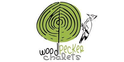 Hüttendorf - Parkplatz direkt an der Hütte - Vorarlberg - Woodpecker Logo - Woodpecker Chalets