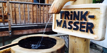 Hüttendorf - Whirlpool: beim Chalet - Wagrain - Wir haben 3 eigene Quellen - Hüttendorf Maria Alm