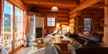 Hüttendorf - Sauna: im Chalet - Turrach - Wohnzimmer mit Kaminofen - Kreischberg Lodge