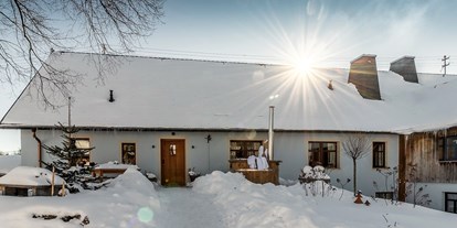 Hüttendorf - Wandern - Franken - Landhaus Chalet für 2 Personen
Terrasse im Winter - Das MUSSEA Landhaus Chalet & Scheunenloft