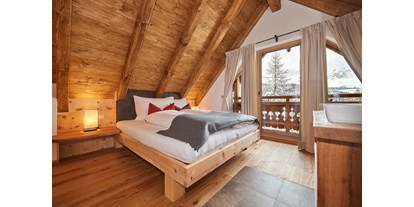 Hüttendorf - Schwerpunkt: Winterurlaub - Schlafzimmer Dachboden mit Dusche und WC - Almidylle 