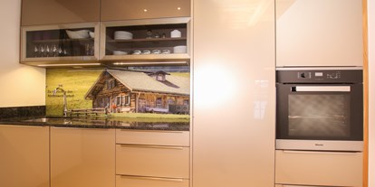 Hüttendorf - Typ: Luxuschalet - Pinzgau - Eine hochwertige Miele Küche mit BORA System und voll ausgestattet!! - Chalet am Müllergut