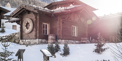 Hüttendorf - Doppelbett - Südtirol - Hotel & Chalets Edelweiss im Winter - Hotel & Chalets Edelweiss