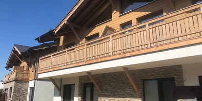 Hüttendorf - zustellbares Kinderbett - Pinzgau - Chalets im modern-alpinen Stil, Südbalkon, Südterrasse und Garten.
 - Grossglockner Chalets