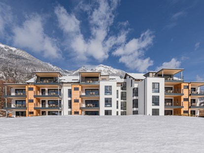 Hüttendorf - Skitouren - Das Hauptgebäude mit den Lake Premium Apartments. - Lake Resort Pressegger See