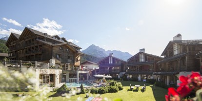 Hüttendorf - offener Kamin - Südtirol - Post Alpina Family Mountain Chalets