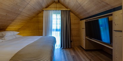 Hüttendorf - Umgebungsschwerpunkt: Berg - Steiermark - Schlafzimmer im Obergeschoss - Hideaway Hotel Montestyria Chalets & Suiten