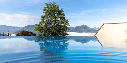 Hüttendorf - Umgebungsschwerpunkt: Berg - Steiermark - Pool mit Ausblick - Hideaway Hotel Montestyria Chalets & Suiten