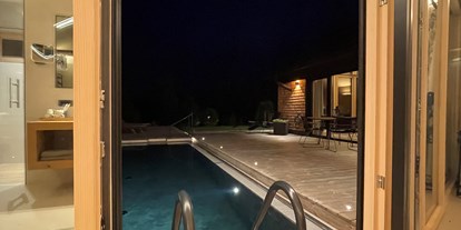 Hüttendorf - Pools: Infinity Pool - Österreich - Luxus Chalet Annelies