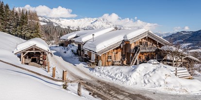 Hüttendorf - Anreise mit dem Auto - Salzburg - Huwi's Alm im Schnee - PRIESTEREGG Premium ECO Resort
