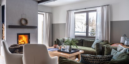Hüttendorf - Schwerpunkt: Skiurlaub - Großzügiger Wohnbereich mit Kamiin - Kauz - Design Chalets
