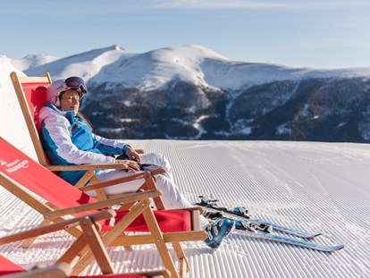 Hüttendorf - Ski-In/Ski-Out: Ski-In & Ski-Out - Österreich - Sonnenskilauf in Bad Kleinkirchheim im März - Trattlers Hof-Chalets