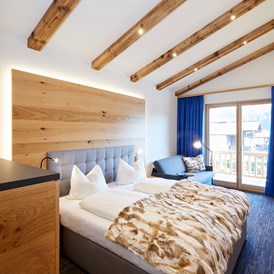 Chalet: Schlafzimmer mit Doppelbett - Chalets Hubertus 