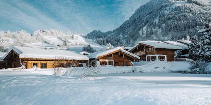 Hüttendorf - Geschirrspüler - Chaletdorf im Winter
 - Alpzitt Chalets