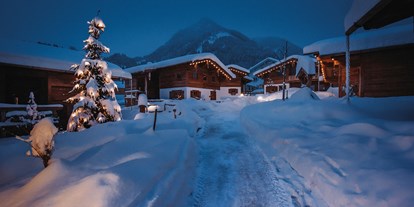 Hüttendorf - Umgebungsschwerpunkt: See - PLZ 87538 (Deutschland) - Winter im Chaletdorf - Alpzitt Chalets