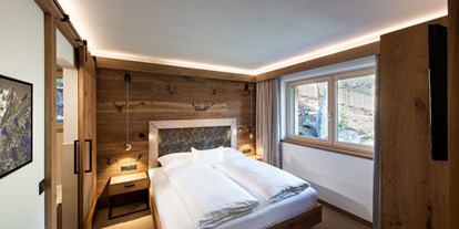 Hüttendorf - zustellbares Kinderbett - Stumm - Chalet Enzian Schlafzimmer - Chalets Alpenjuwel