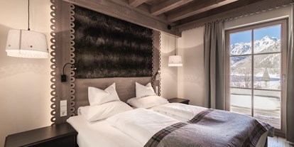 Hüttendorf - Kachelofen - Italien - Schlafzimmer Chalets Edelweiss Schnalstal - Hotel & Chalets Edelweiss