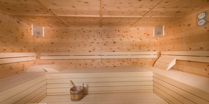 Hüttendorf - Doppelbett - Hintermuhr - Sauna im Chalet Edelweiß - EDELWEISS CHALETS Zauchensee