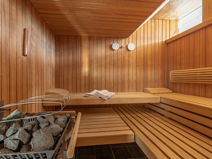 Hüttendorf - Wellnessbereich: im Hauptgebäude - Finnische Sauna. - Lake Resort Pressegger See