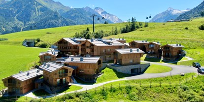 Hüttendorf - Terrasse - PLZ 6370 (Österreich) - Das Zaglgut im Sommer - Bergdorf Hotel Zaglgut Ski In & Ski Out