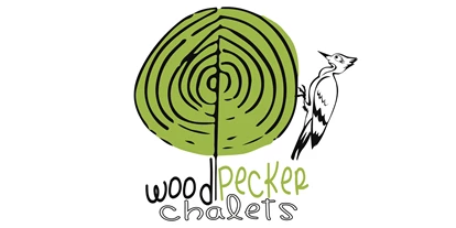Hüttendorf - Alleinlage - Strengen - Woodpecker Logo - Woodpecker Chalets