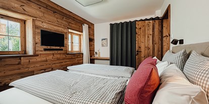 Hüttendorf - zustellbares Kinderbett - Bayrischzell - Chalets Bayrischzell mit privatem Hottub und Sauna
