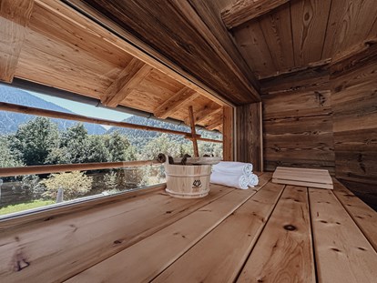 Hüttendorf - zustellbares Kinderbett - Kapfing - Chalets Bayrischzell mit privatem Hottub und Sauna