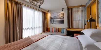 Hüttendorf - WLAN - Felberach - Schlafzimmer im Untergeschoss - Hideaway Hotel Montestyria Chalets & Suiten