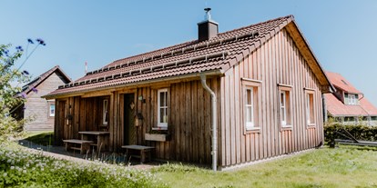 Hüttendorf - Abbenrode - Kuschel Lodge mit Himmelbett, freistehender Badewanne, Kamin, Sauna und eigenen Whirpool.  - Torfhaus HARZRESORT