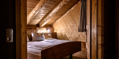 Hüttendorf - Typ: Blockhütte - Chalet Morgensonne Schlafzimmer - Heumanns Blockhäuser am Wald