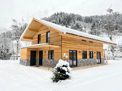 Hüttendorf - Sauna: im Chalet - Oberwollanig - Chalet Doppel im Winter - DualResorts Afritz am See