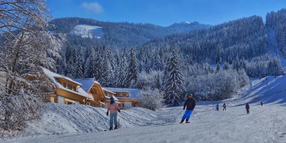 Hüttendorf - Skiraum: im Chalet - PLZ 9546 (Österreich) - Chalets direkt an der Skipiste - Trattlers Hof-Chalets