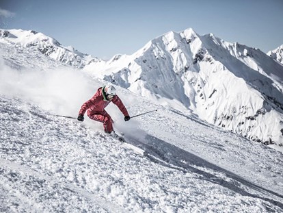 Hüttendorf - Schwerpunkt: Skiurlaub - Das Gebiet Warth-Schröcken ist für seine Freerideabfahrten bekannt, von denen viele bequem über den Lift erreichbar sind - Aadla Walser-Chalets am Arlberg