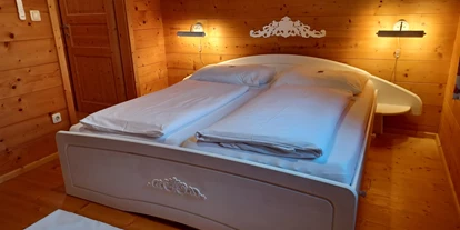 Hüttendorf - Schwerpunkt: Badeurlaub - Bio-Schlafzimmer - Ferienhäuser Aura
