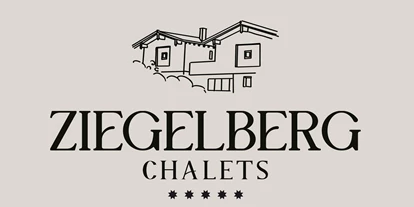 Hüttendorf - Parkplatz direkt an der Hütte - Logo Ziegelberg Chalets - 5-Sterne Chalet Waldblick