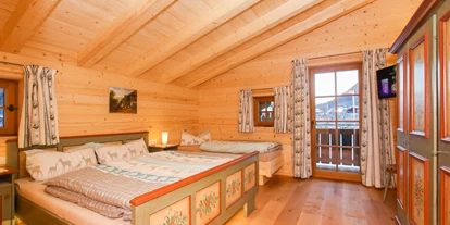 Hüttendorf - Chaletgröße: 8 - 10 Personen - Gemütliches Doppelzimmer mit einem dritten Bett - Chalet am Müllergut