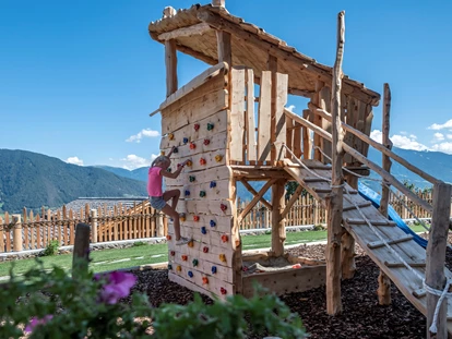 Hüttendorf - Whirlpool: beim Chalet - Spielplatz - Dilia Dolomites