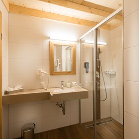 Chalet: Eines der Badezimmer im Chalet - EDELWEISS CHALETS Zauchensee