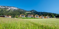 Hüttendorf - Kirchberg in Tirol - Hotelanlage und Nebenhaus mit Pferdestall - Beim Hochfilzer-Hotel & Premium Chalets ****s