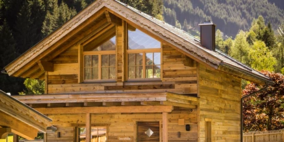Hüttendorf - Pfunds - Saunahütte mit Relaxoase - Wellness Hüttendorf Wiese