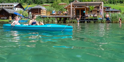 Hüttendorf - Schwerpunkt: Badeurlaub - Badesteg mit Badehaus. Ein Ruderboot und 2 Stück 2er Kanus stehen Ihnen exklusiv zur Verfügung. - Im Franzerl am Weissensee
