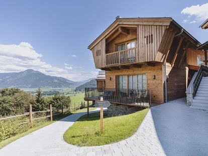 Hüttendorf - Chaletgröße: 4 - 6 Personen - Pinzgau - Außenansicht Panorama See Chalets - Bergdorf Hotel Zaglgut Ski In & Ski Out