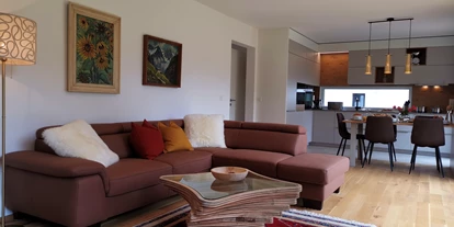 Hüttendorf - Toblach - Wohnzimmer & Küche - Lodge Mira - TYROL PURElife Lodges