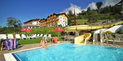 Hüttendorf - Chaletgröße: 8 - 10 Personen - Außenpool mit Wasserrutsche - Glocknerhaus Naturdomizil