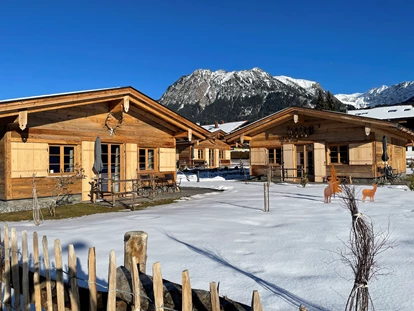 Hüttendorf - Schröcken - Verbringe sonnige Wintertage im Chaletdorf Alpglück - Alpglück Chalets *****