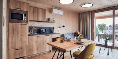 Hüttendorf - Schwerpunkt: Badeurlaub - Studio Essbereich - Kittenberger Chalets am Gartensee