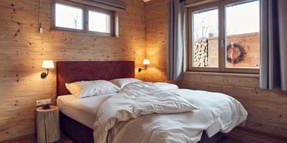 Hüttendorf - Schwerpunkt: Badeurlaub - Landhaus Schlafzimmer  - Kittenberger Chalets am Gartensee