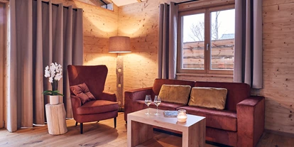 Hüttendorf - Schwerpunkt: Badeurlaub - Landhaus Sitzecke  - Kittenberger Chalets am Gartensee