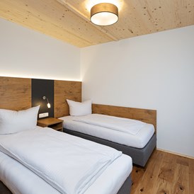 Chalet: Schlafzimmer mit 2 Einzelbetten - Niederauer Hof Chalets